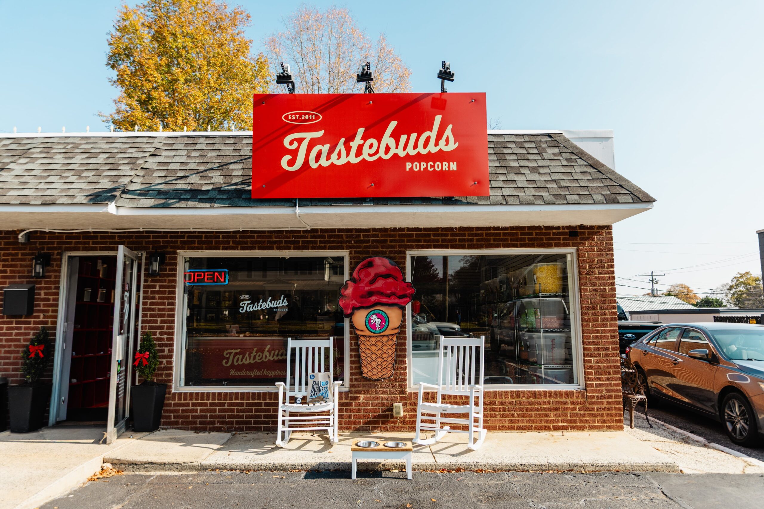Family-owned popcorn shop in downtown Belmont offering over 200 locally popped flavors